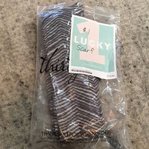 Sheer gray and purple scarf.